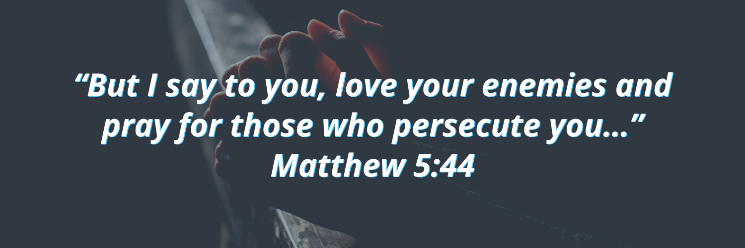 Praying hands with Matthew 5:44 overtop