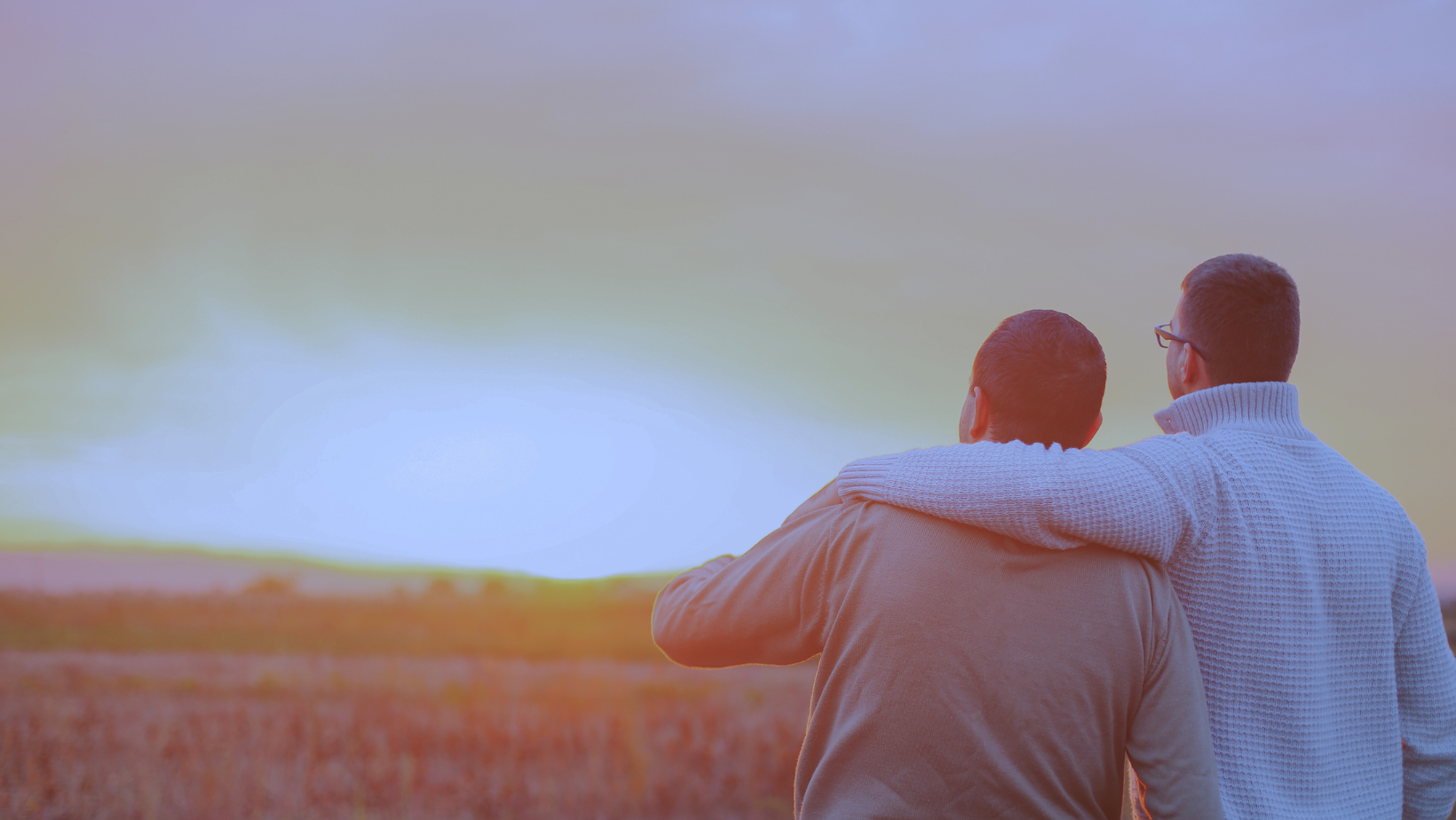 Blog title image - Two friends looking at sunset together